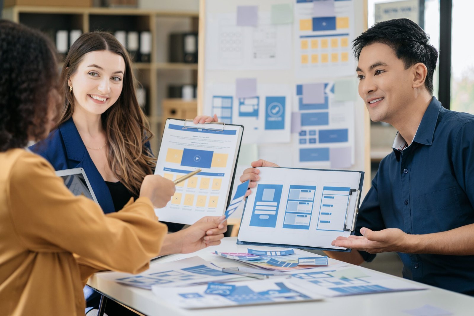Business people meeting and discussing design ideas at a table