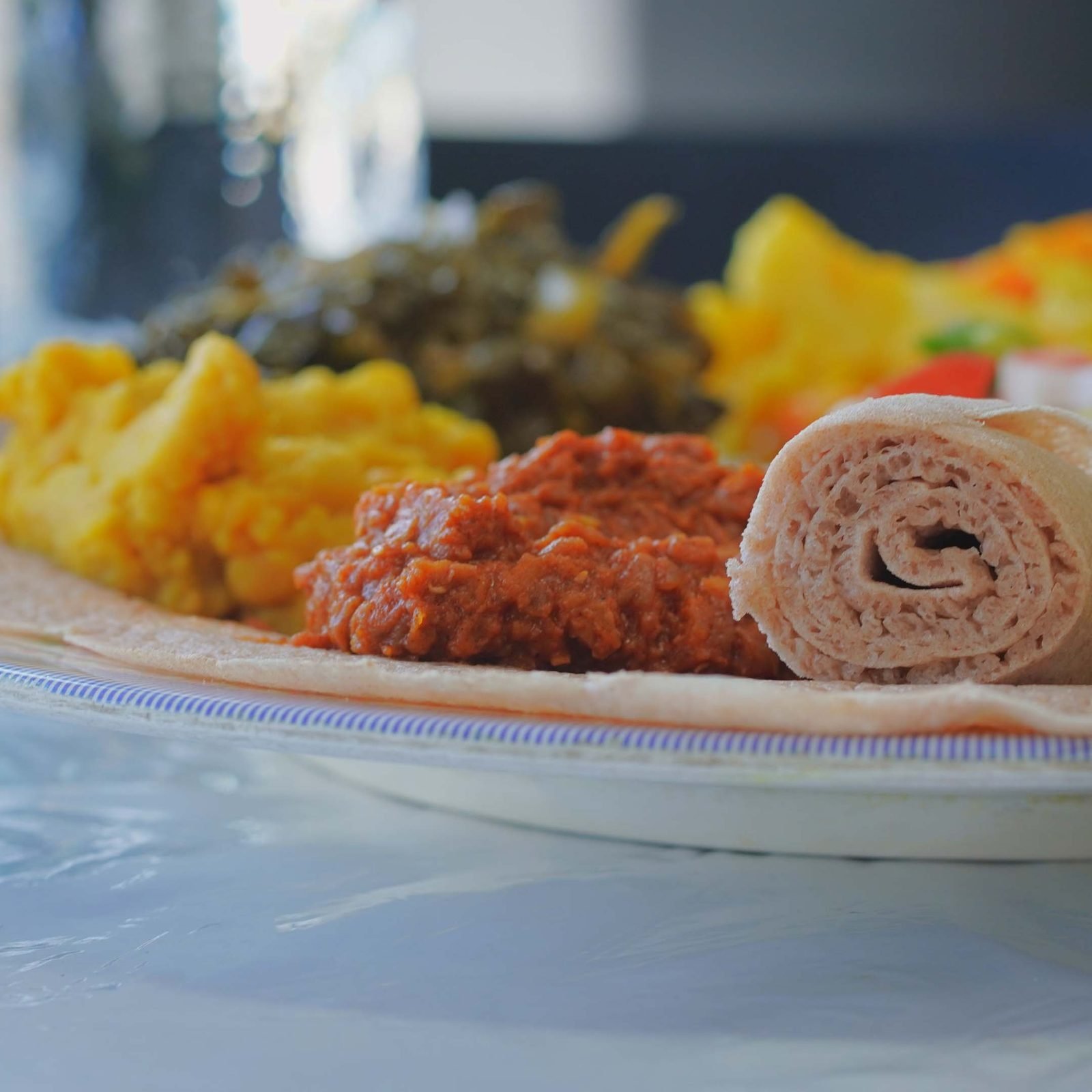 An injera platter photographed on a Lumex shoot