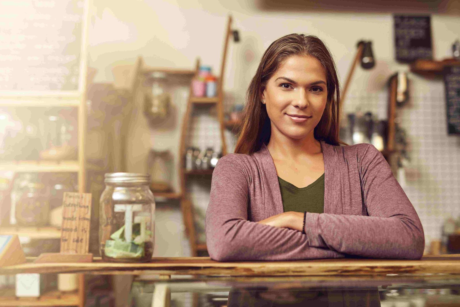 A cafe owner photographed behind the counter