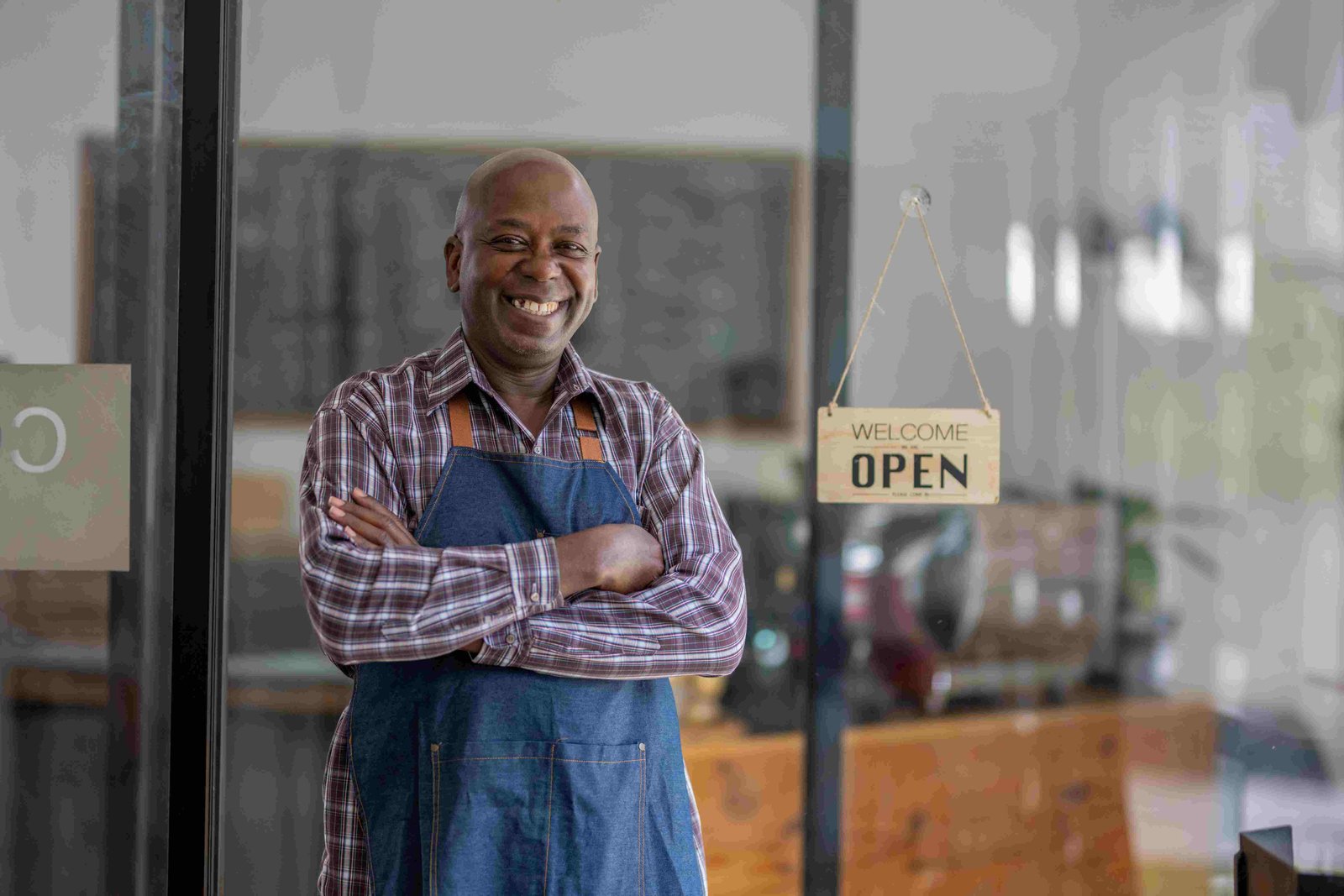 A business owner photographed outside their shop